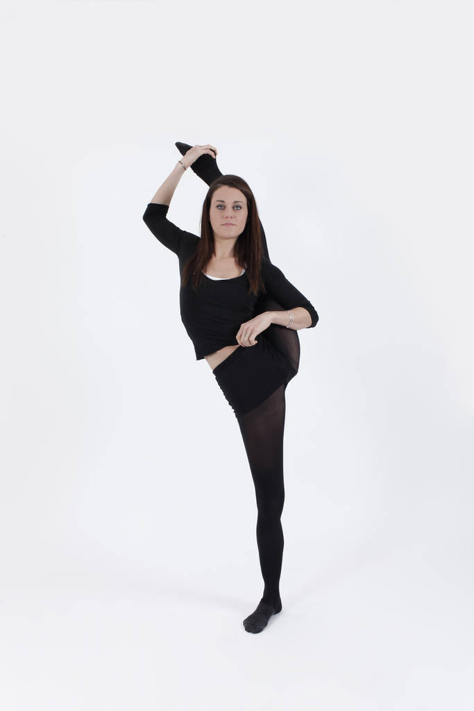 Young gymnast in black looking at the camera - Photo, Image