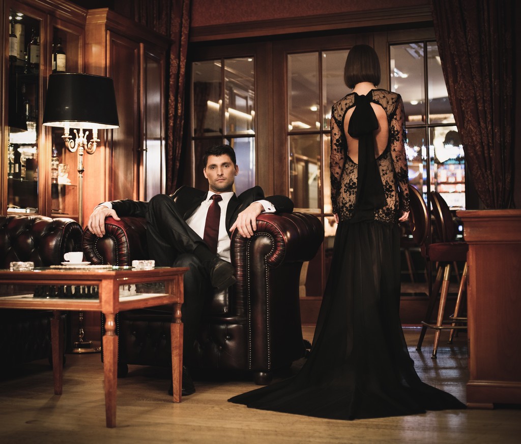 Elegant couple in formal dress in luxury cabinet - Photo, Image