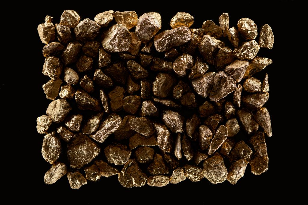 top view of gold stones in pile isolated on black - Photo, Image