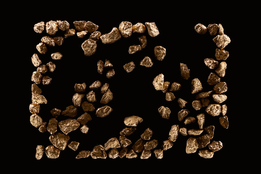 ylhäältä näkymä hajallaan kultaa kiiltävät kivet eristetty musta
 - Valokuva, kuva