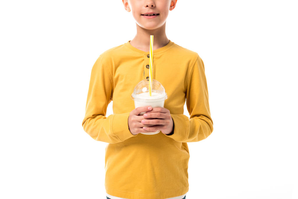 vista cortada de criança feliz segurando milkshake isolado no branco
 - Foto, Imagem