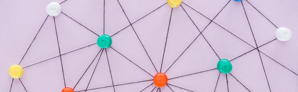 panoramic shot of colorful push pins connected with strings Isolated On pink, network concept - Photo, Image