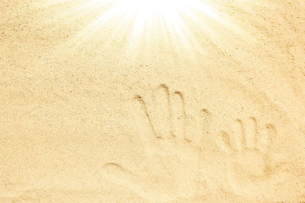 Bellissimo disegno sulla sabbia dello sfondo del mare - Foto, immagini