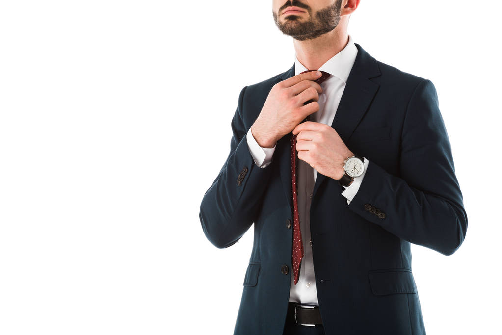 обрезанный вид бизнесмена в черном костюме трогательный галстук изолирован на белом
 - Фото, изображение