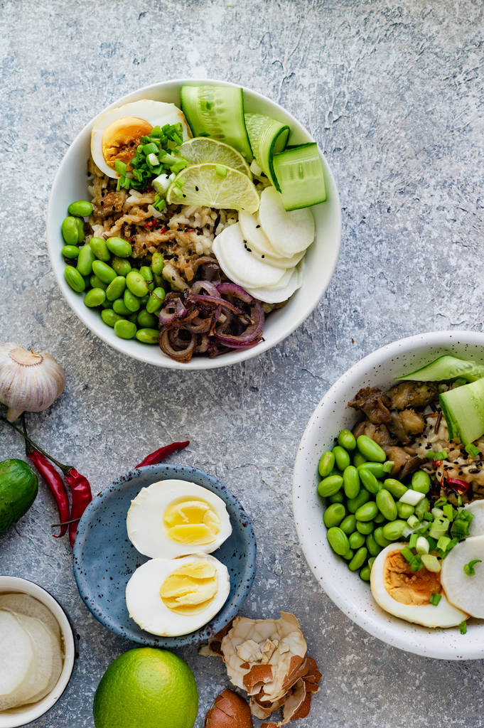Vegetarian dishes with marinated egg and edamame beans in bowls  - Photo, Image