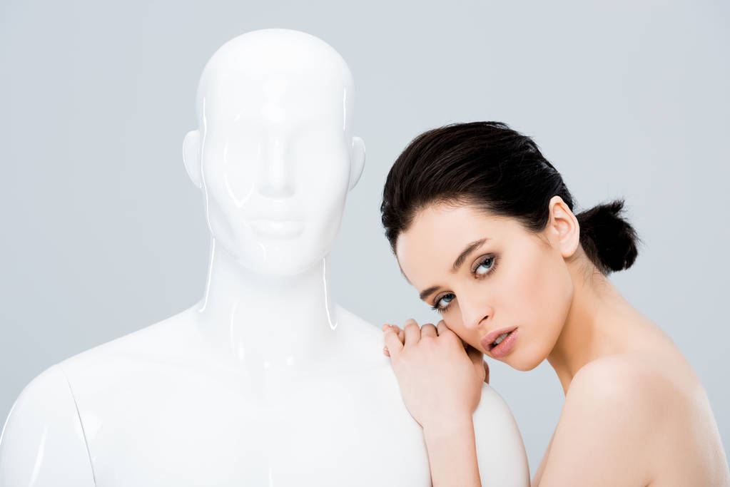 attractive girl posing with mannequin and looking at camera isolated on grey - Photo, Image
