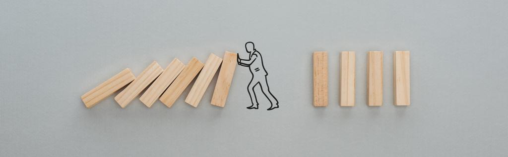panoramic shot of drawn man pushing wooden blocks on grey background, business concept - Photo, Image