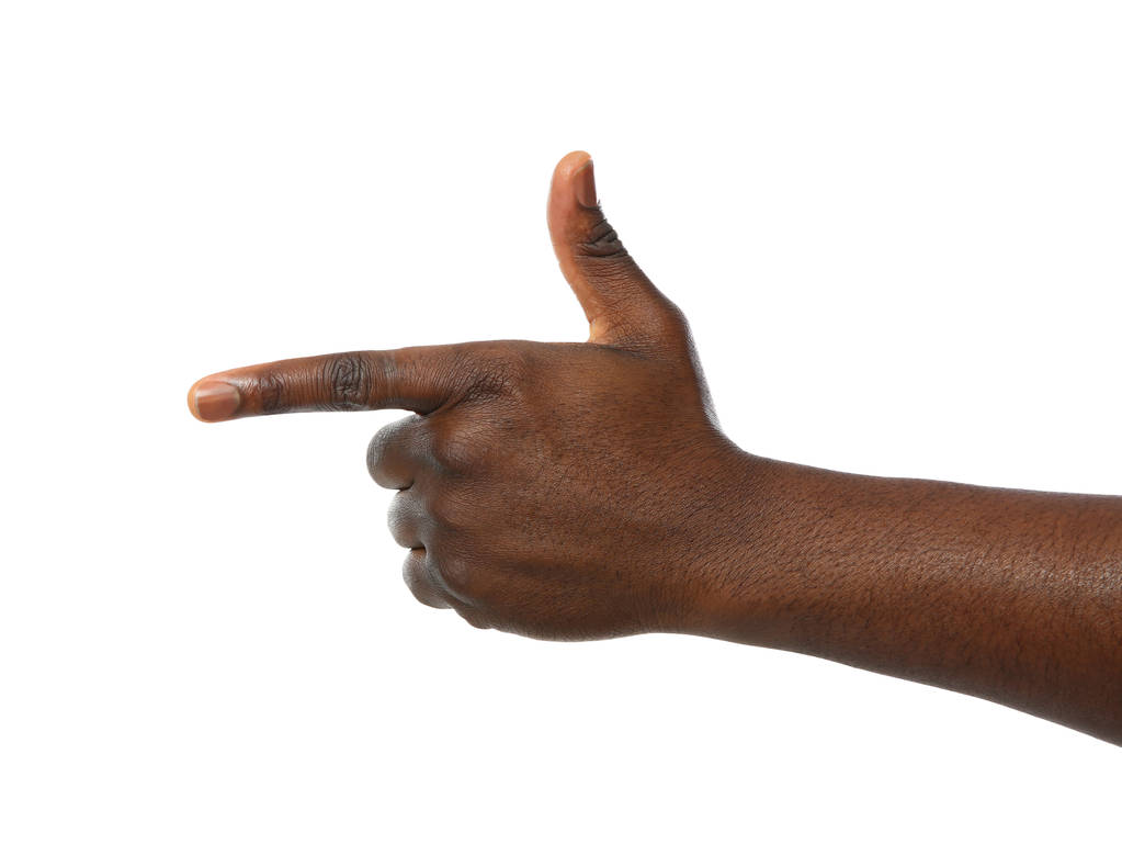 Hombre afroamericano señalando algo sobre fondo blanco, primer plano
 - Foto, Imagen