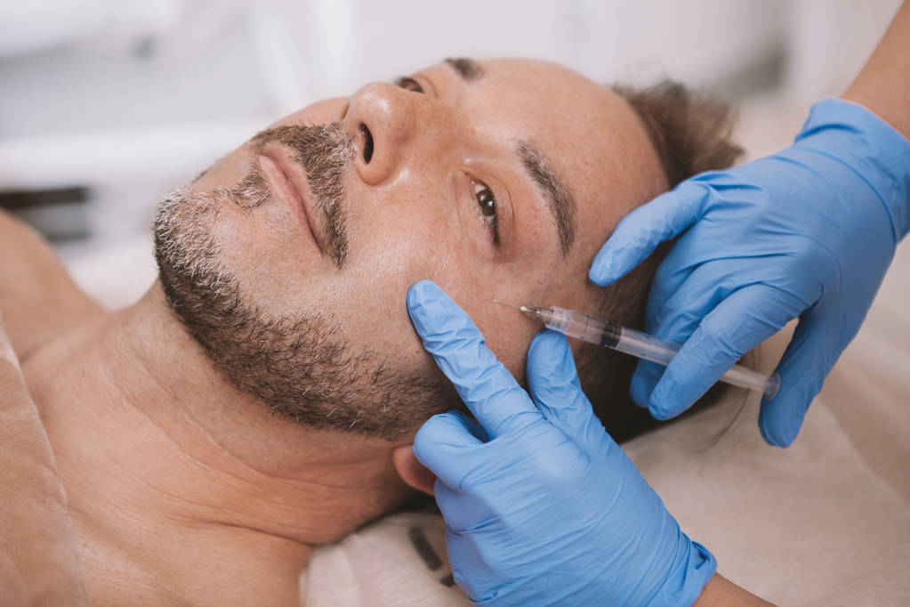 Mature man getting facial filler injections - Fotografie, Obrázek
