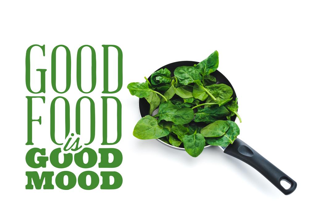 fresh spinach leaves in frying pan on white background near good food is good mood green lettering - Photo, Image