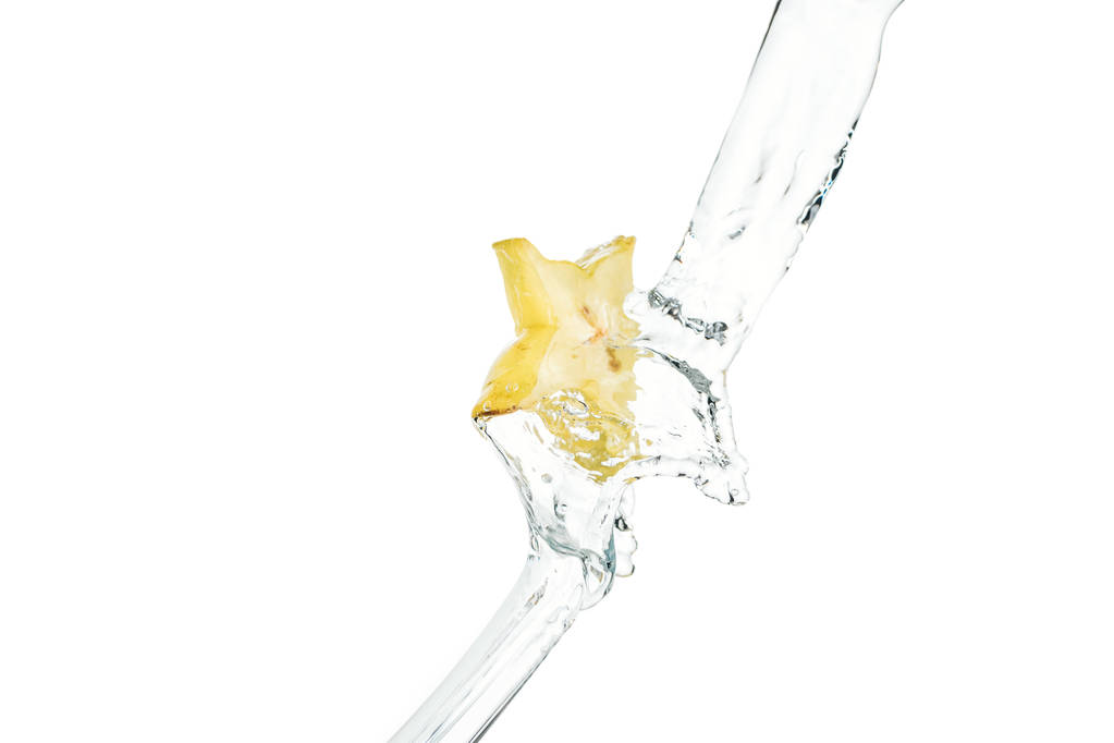 fresh exotic star fruit slice and flowing water isolated on white - Photo, Image