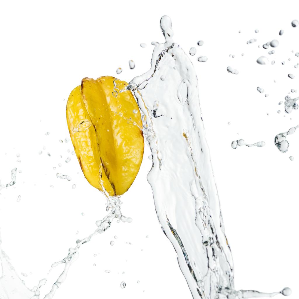 whole ripe exotic star fruit and clear water splash with drops isolated on white - Photo, Image
