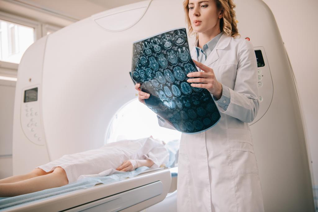 attentive radiologist examining tomography diagnosis during patients diagnostics  - Photo, Image