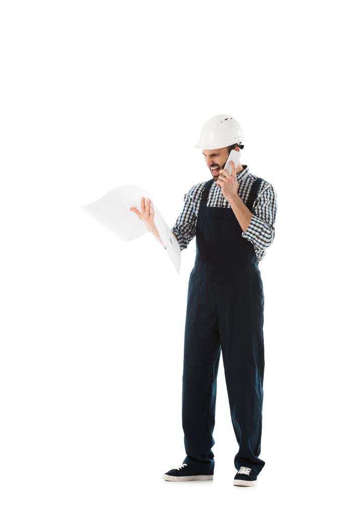 irritated foreman screaming while talking on smartphone and looking at camera isolated on white - Photo, Image