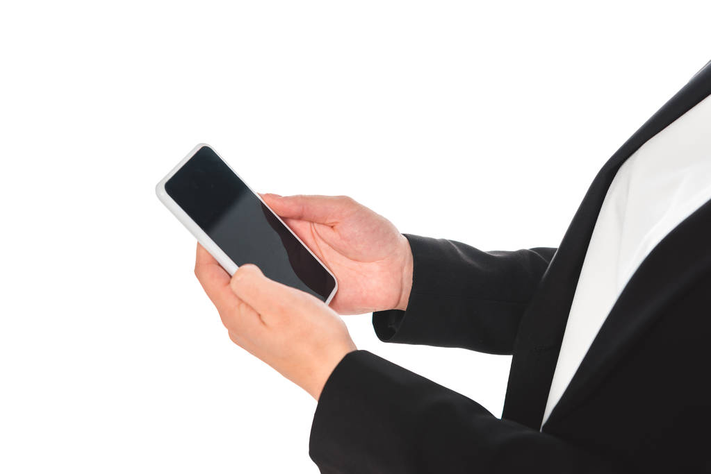 gedeeltelijke weergave van zakenvrouw met smartphone met blanco scherm geïsoleerd op wit - Foto, afbeelding