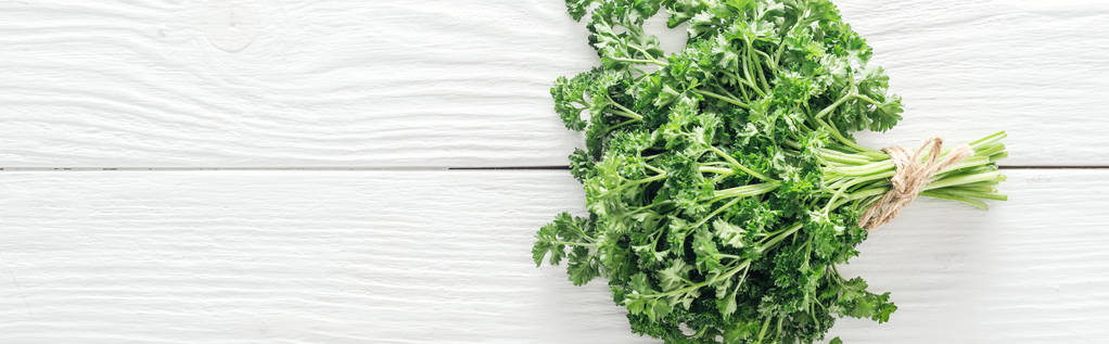 top view of green parsley on white wooden table, panoramic shot - Photo, Image