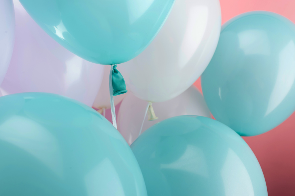 close up view of decorative festive balloons on pink background - Photo, Image