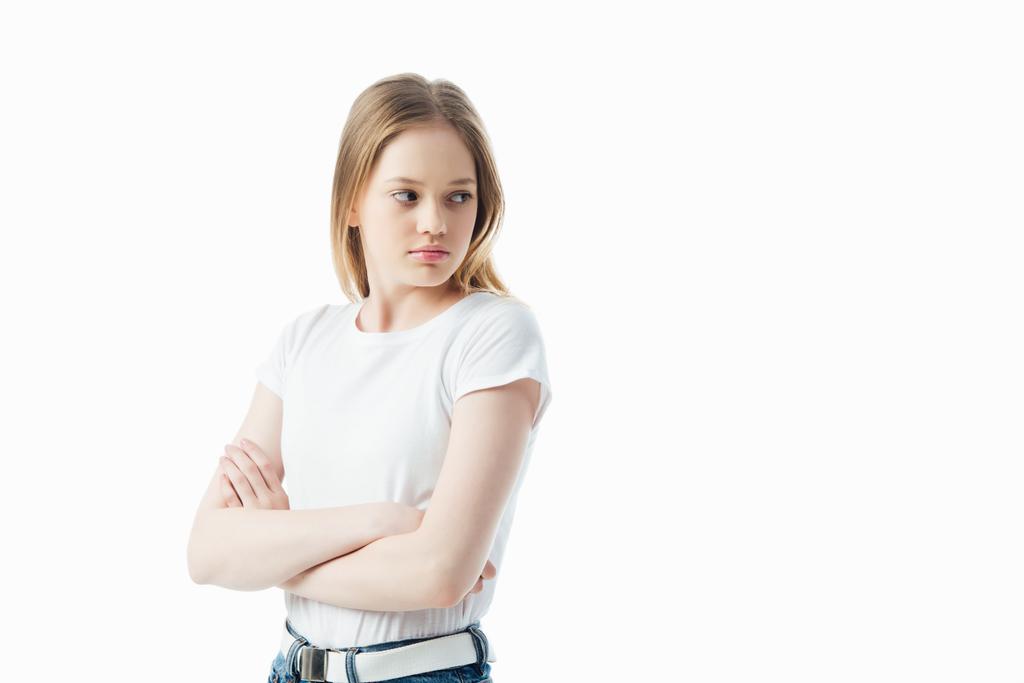 menina adolescente ofendida com braços cruzados olhando para longe isolado no branco
 - Foto, Imagem