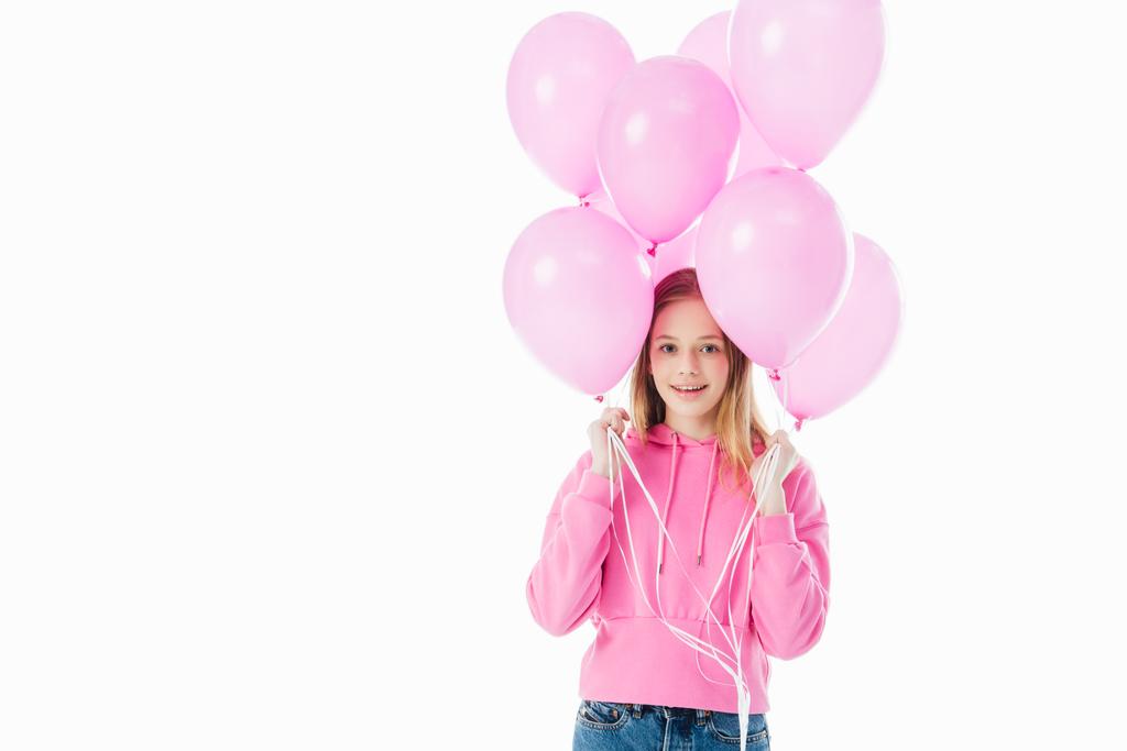 boldog tizenéves lány gazdaság rózsaszín léggömbök elszigetelt fehér - Fotó, kép