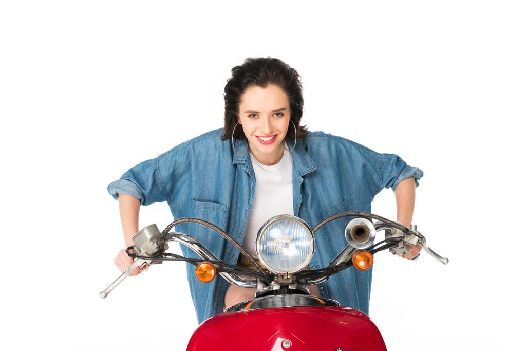 front view of girl ready to ride sitting on red scooter isolated on white - Photo, Image