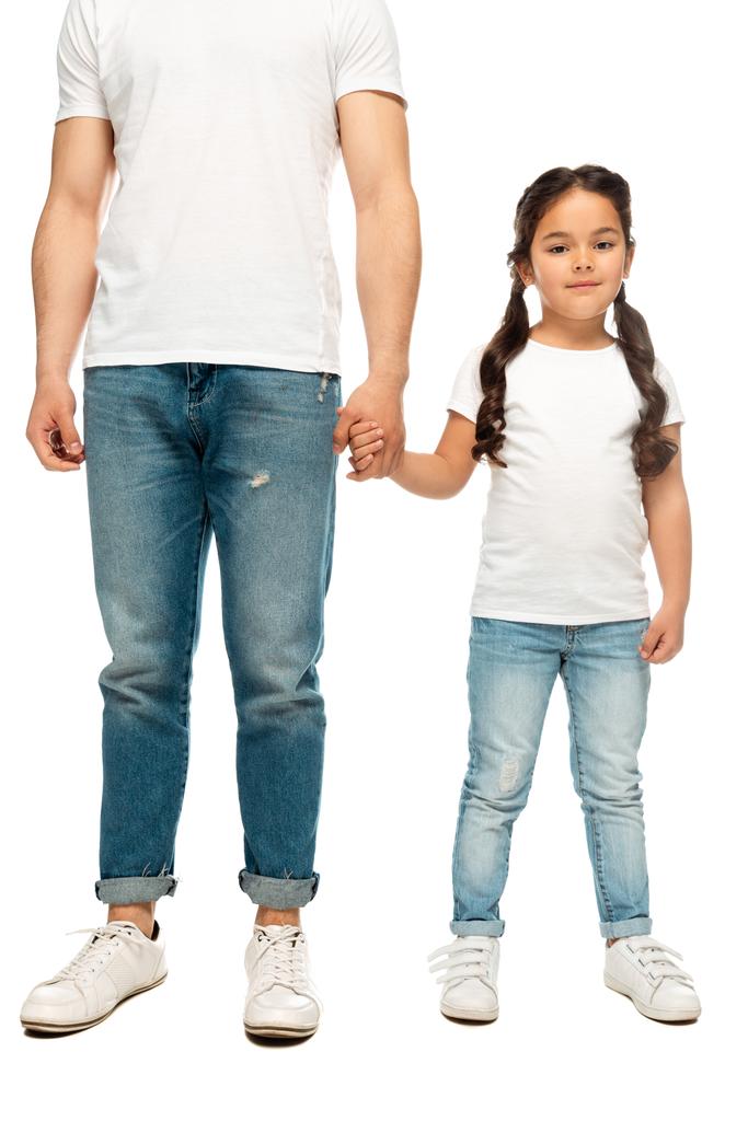 beyaz izole sevimli kızı ile el ele tutuşan baba kırpılmış görünümü  - Fotoğraf, Görsel