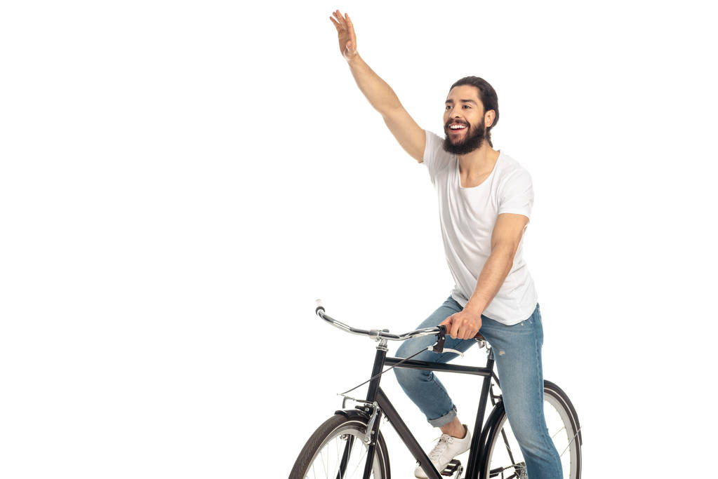 alegre latino montar en bicicleta y gesto aislado en blanco
  - Foto, imagen