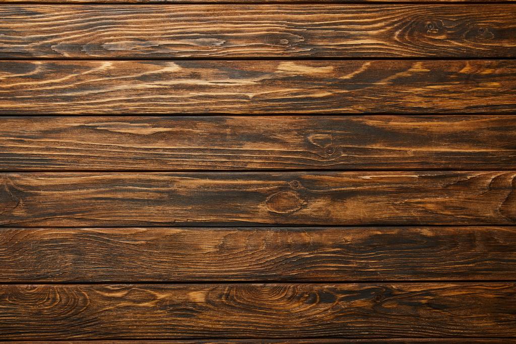 bovenaanzicht van leeg bruin houten oppervlak met Kopieer ruimte - Foto, afbeelding