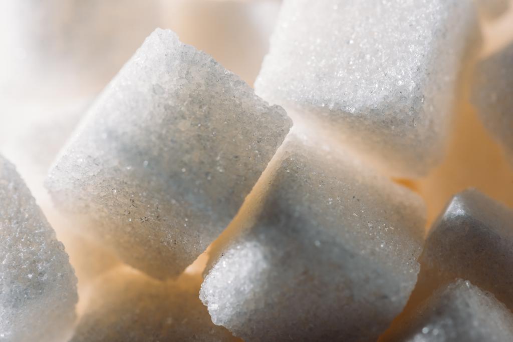 close up view of lightened refined white sugar cubes  - Photo, Image