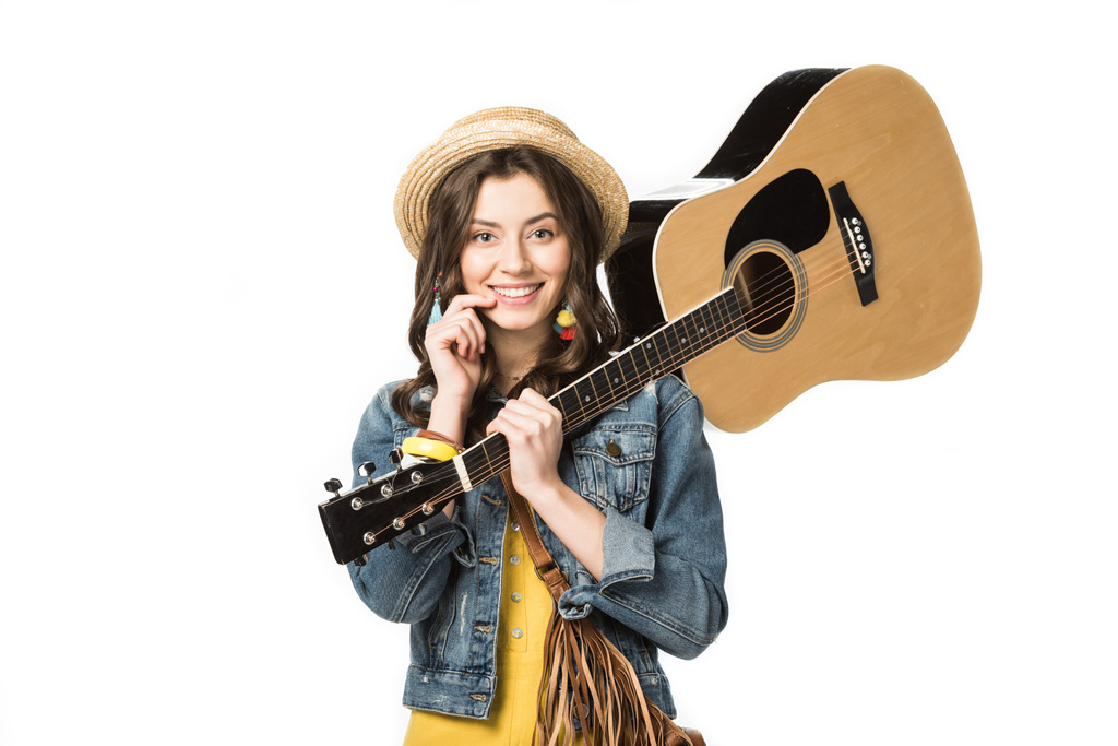 smiling hippie girl holding acoustic guitar isolated on white - Photo, Image