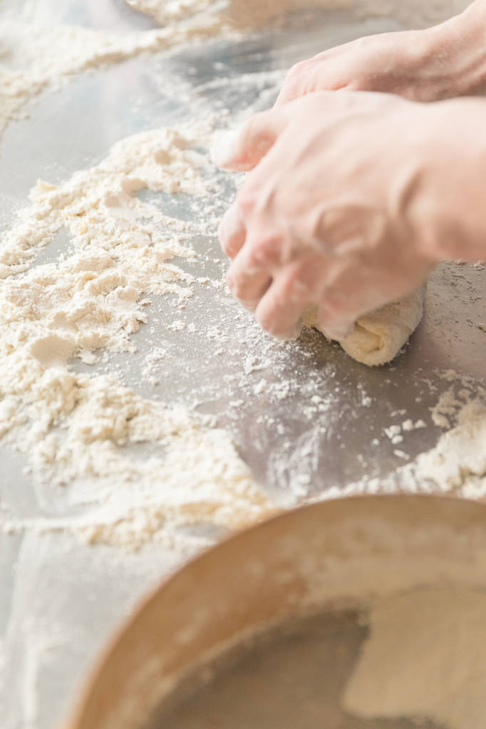 man and woman hands dough in the kitchen - Photo, Image