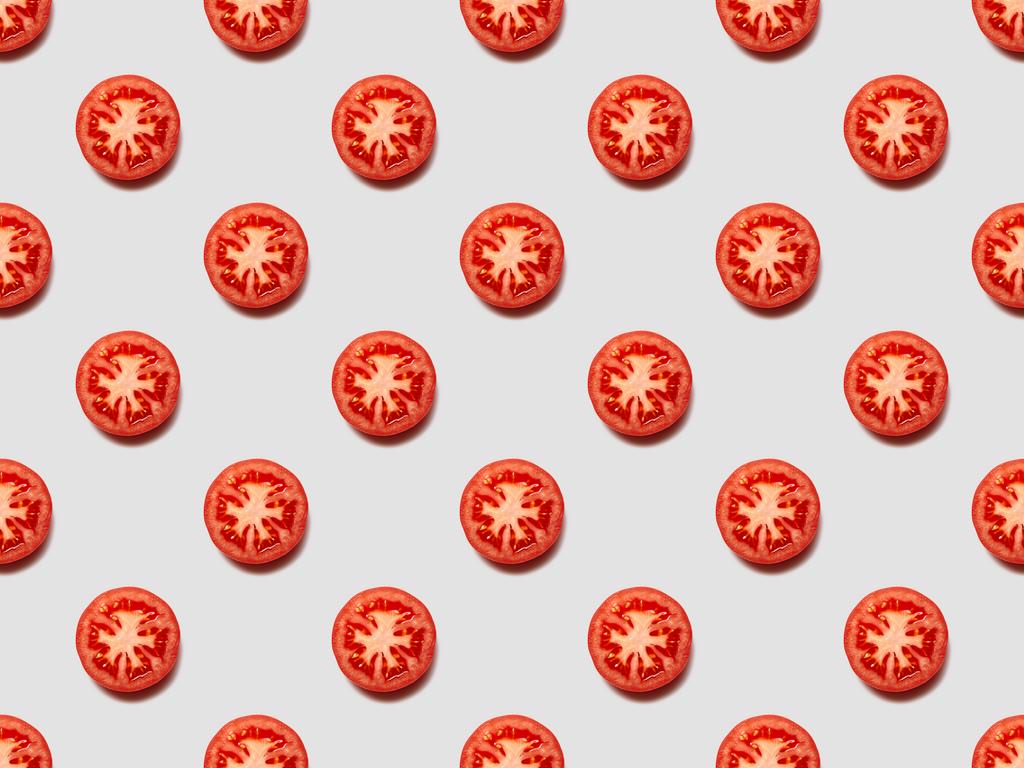 vue du dessus des tranches de tomates rouges sur fond blanc, motif sans couture
 - Photo, image