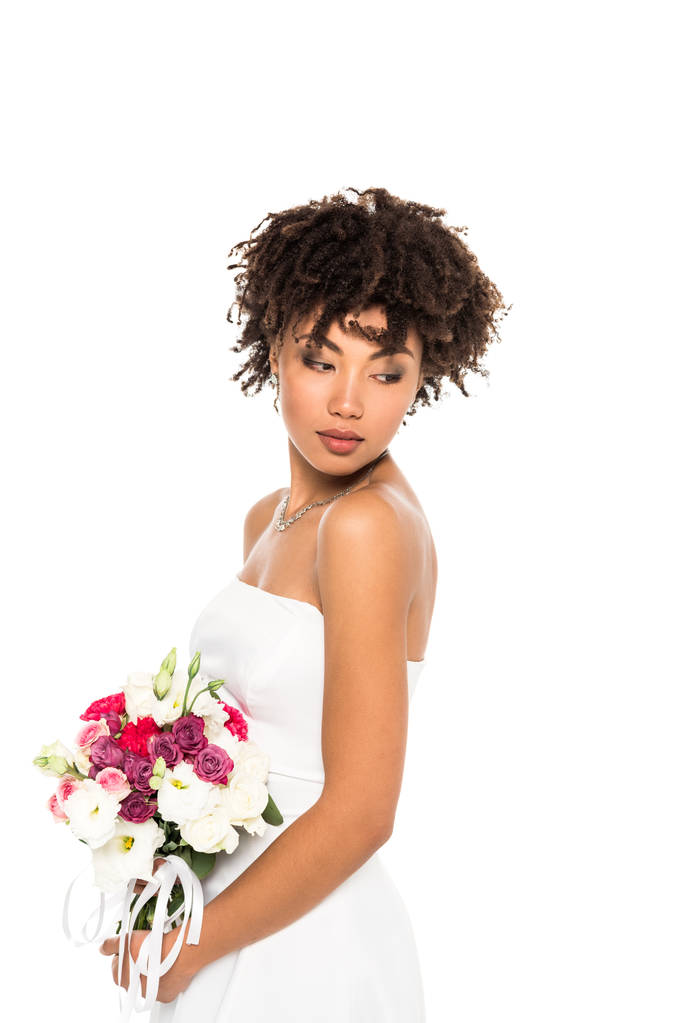 beautiful african american girl in wedding dress holding bouquet isolated on white  - Photo, Image