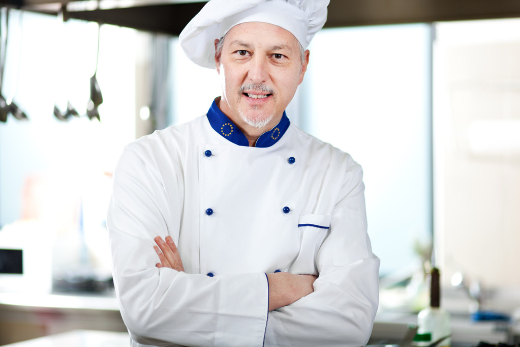 usměvavý kuchař v kuchyni - Fotografie, Obrázek