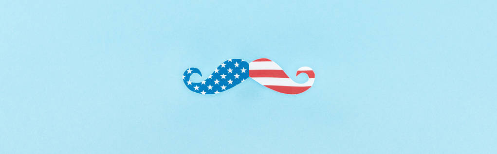 top view of mustache made of american flag on blue background, panoramic shot  - Photo, Image