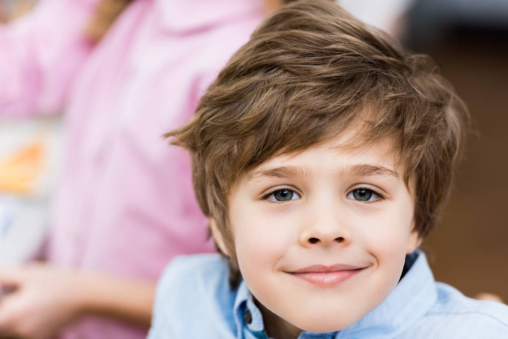 close up of cheerful child smiling while looking at camera  - Photo, Image