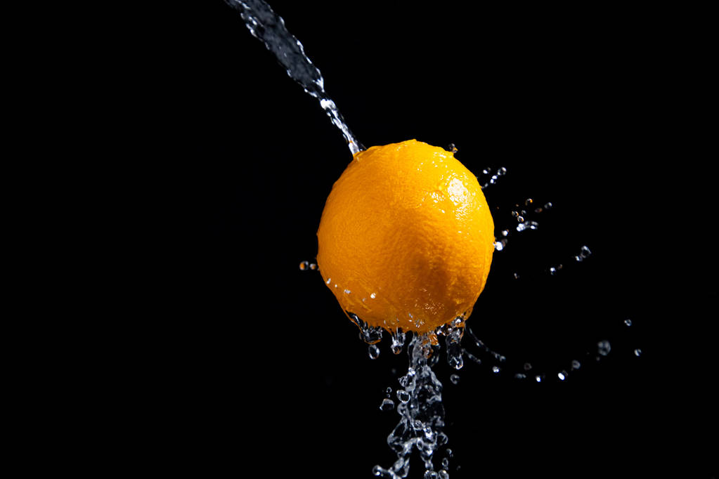 narancs splash fekete háttér - Fotó, kép
