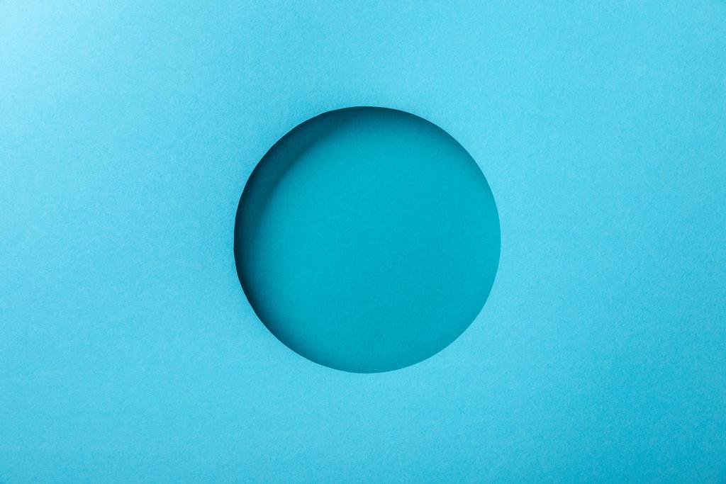 blue paper background with minimalistic round hole - Photo, Image