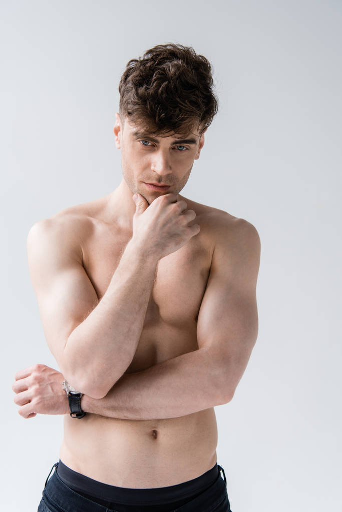 pensive shirtless muscular man in wristwatch isolated on grey - Photo, Image