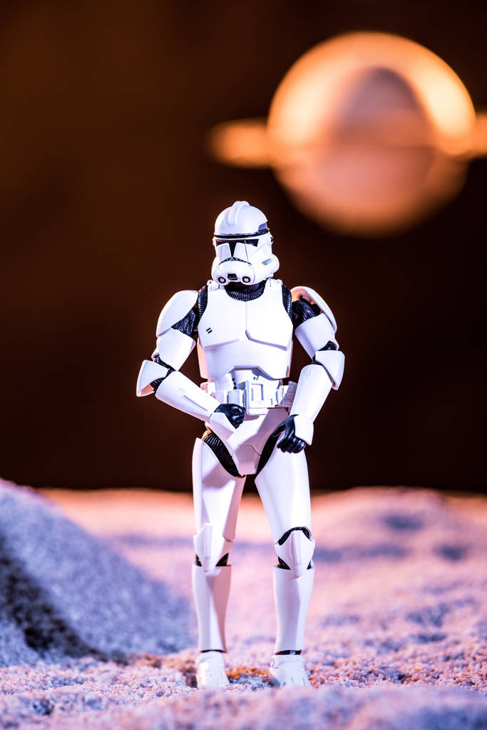 white imperial stormtrooper on cosmic planet on dark background - Φωτογραφία, εικόνα