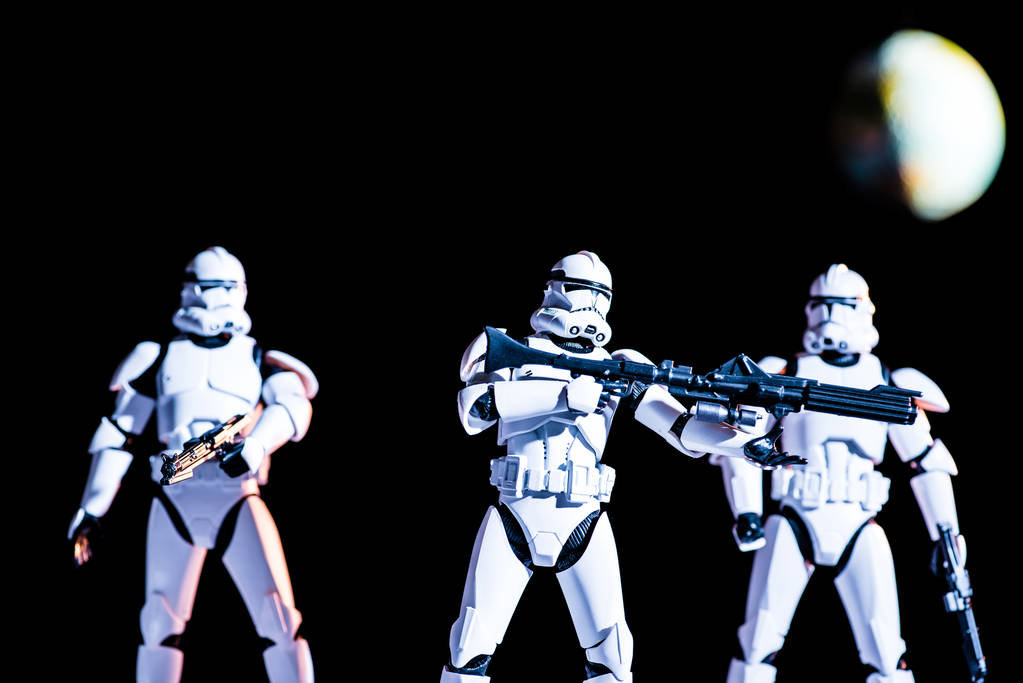 armed white imperial stormtroopers on black background with planet Earth - Zdjęcie, obraz