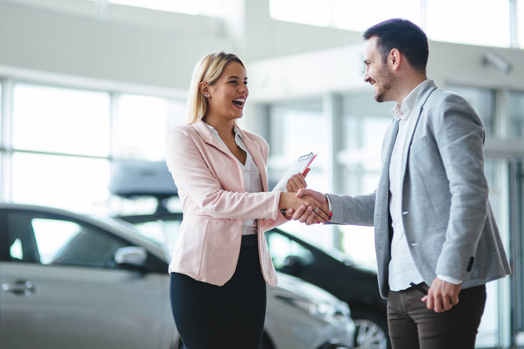 Portrait of happy young customer buying new car - Photo, Image