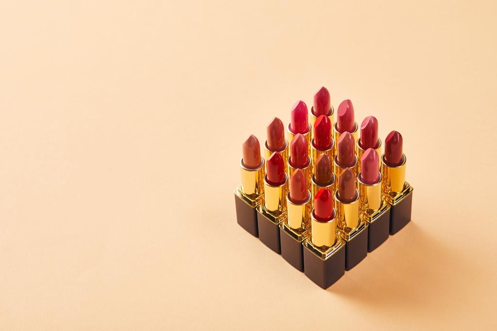 various lipsticks on beige with copy space - Photo, Image