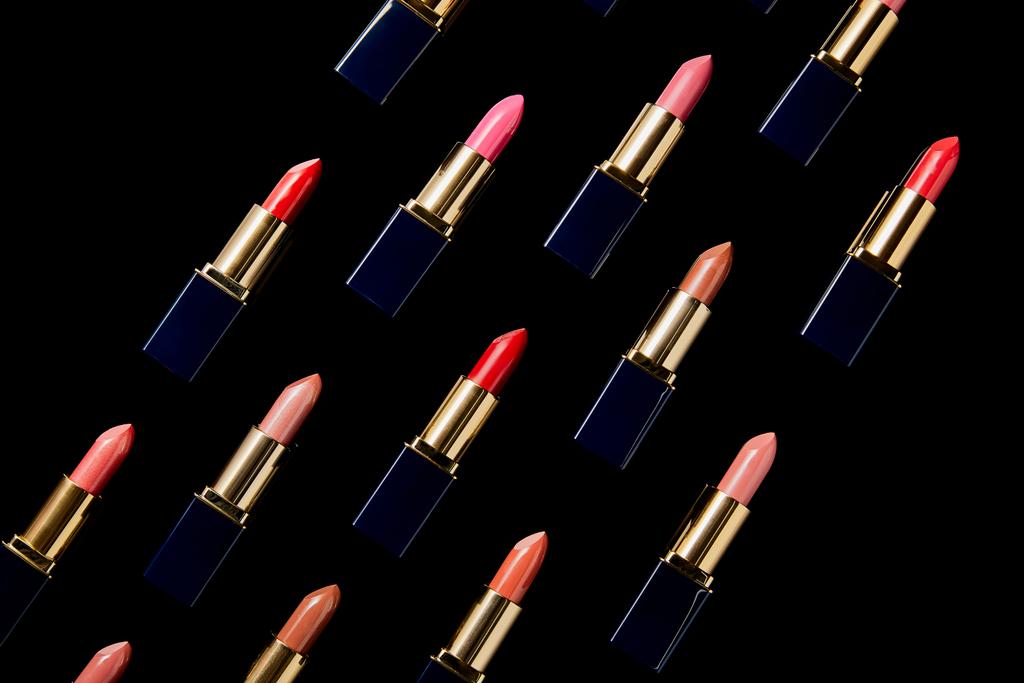 flat lay with various shades of lipsticks isolated on black    - Photo, Image