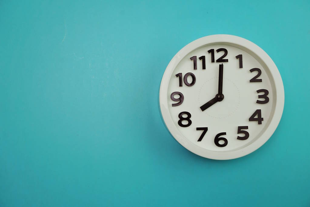 White clock isolated With space copy on Blue background - Photo, Image