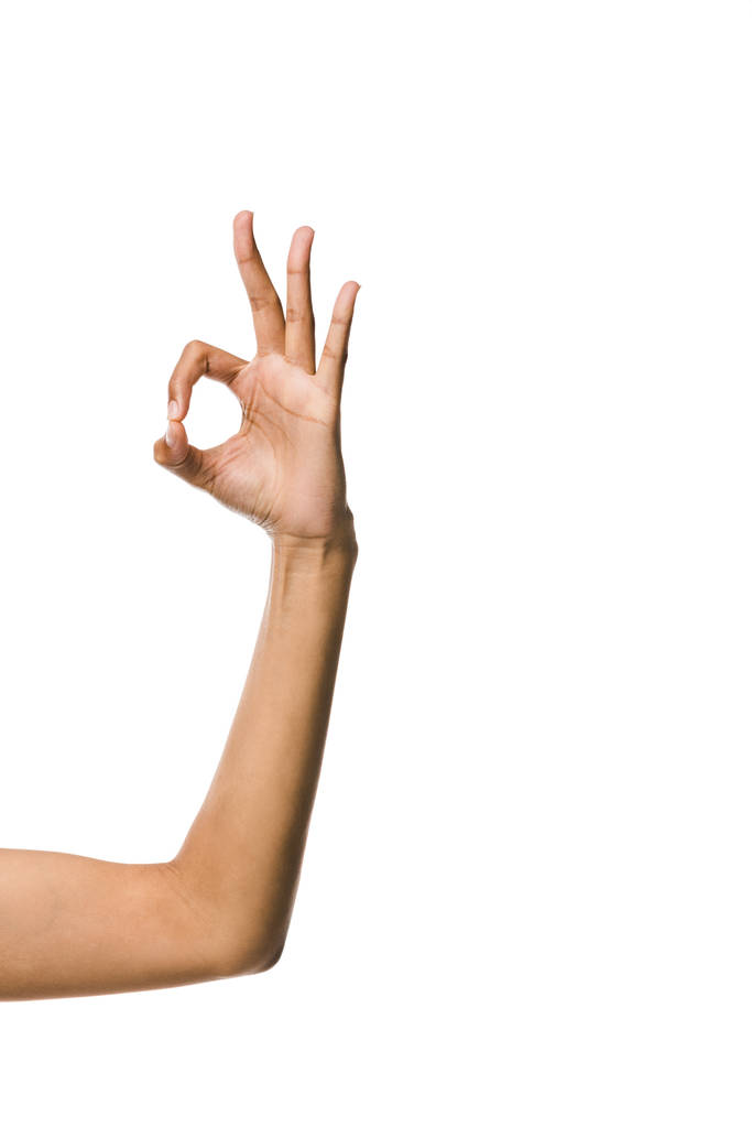 обрізаний вид афроамериканської жінки, що показує знак ОК ізольовано на білому
  - Фото, зображення