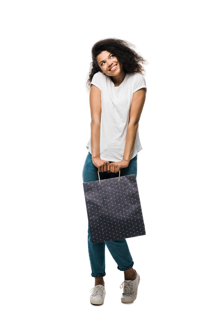 African American Girl trzyma na zakupy torba stojący na białym tle  - Zdjęcie, obraz