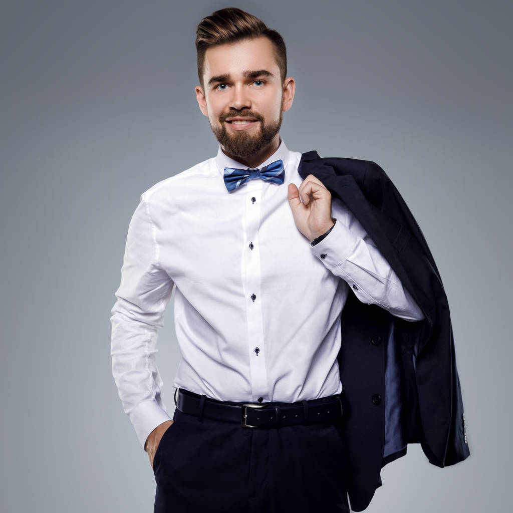 stilvoller gutaussehender Mann im klassischen Anzug mit Fliege - Foto, Bild
