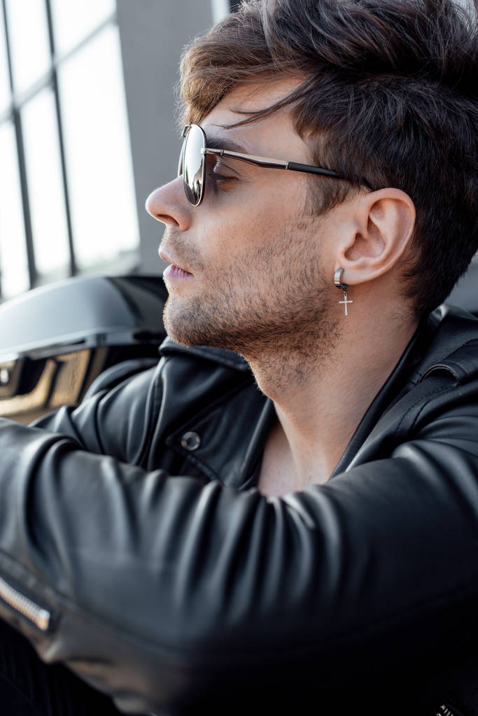 selective focus of handsome motorcyclist looking away - Photo, Image