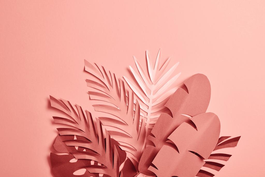 bunch of paper cut palm leaves on pink background - Photo, Image