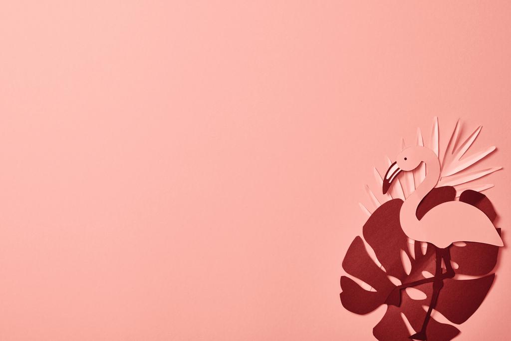 top view of paper cut flamingo on palm leaves on pink background - Photo, Image